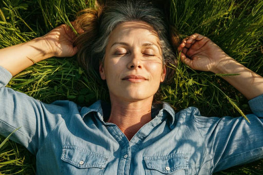 Bare feet on grass and a Tala grounding sheet, showing daily grounding habits