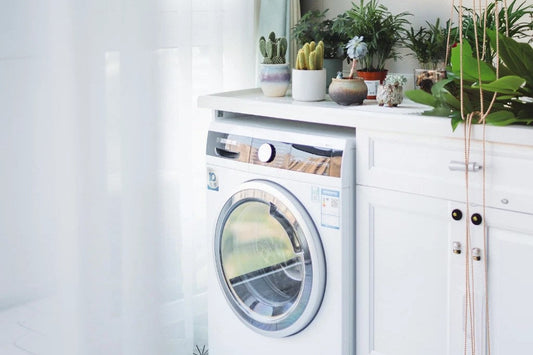 Tala grounding sheet folded with laundry, illustrating safe care and drying